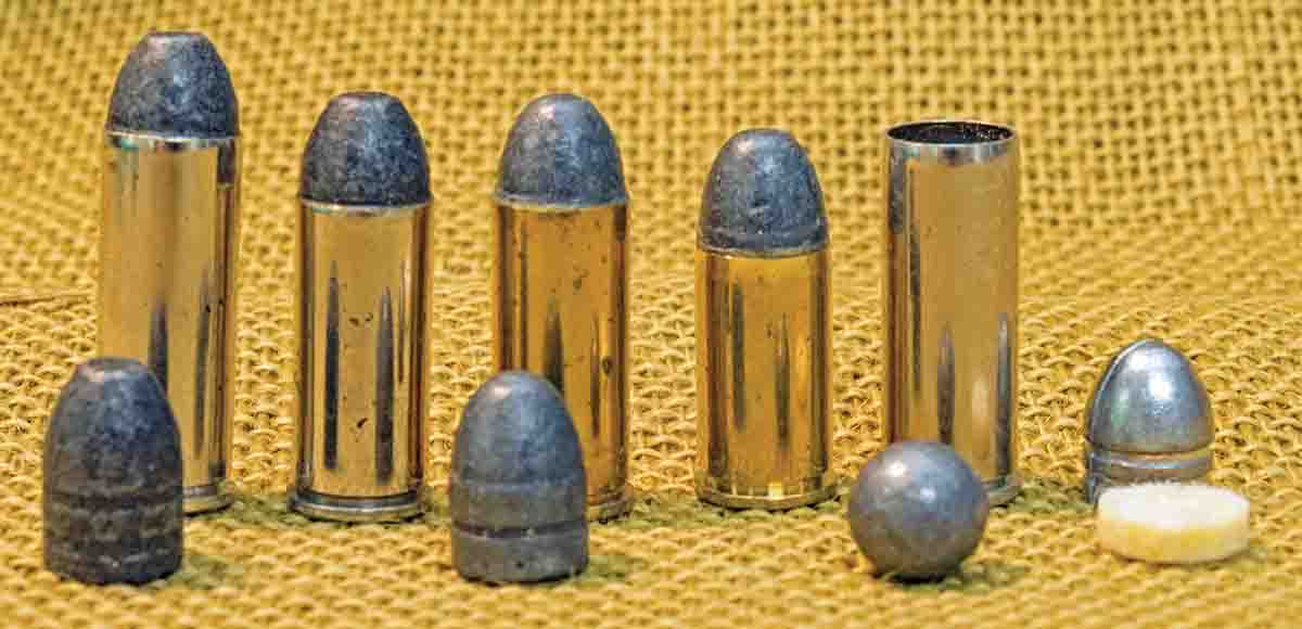 Rear (left to right): A .45 Colt, .45 Colt Government, .45 S&W, .45 Cowboy Special and .45 Colt Gallery. Front (left to right): 250-grain bullet, 230-grain bullet .454 roundball and 200-grain .44 percussion bullet with felt wad.